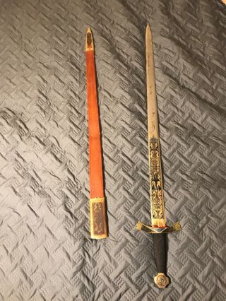 Sword With Engraving From Toledo Spain In.  Comes With Sheath.