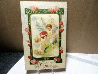 1909 Winsch Postcard Valentines Day Cupids Tie Hearts Together
