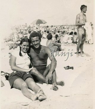 Studly Swimsuit Man With Girl Sitting On Beach With Feet In Camera Old Photo
