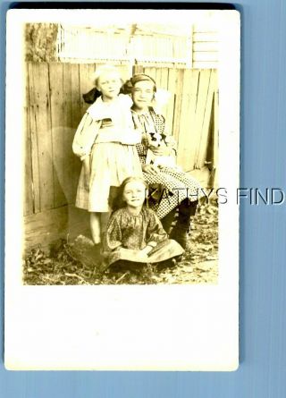 Real Photo Postcard L,  2036 Woman In Dress Sitting With Girls In Dresses By Fence