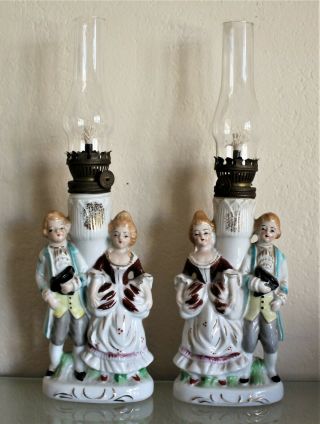 Vintage Porcelain Oil Lamps.  A Colonial Couple Figurines,  Collectible