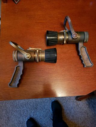 Two Solid Brass Elkhart Fire Nozzles In Strait From A Fire.