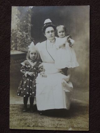Nurse / Nanny Wearing Glasses With Two Cute Young Girls Vtg Photo Postcard