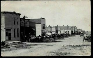 Grant Nebraska,  West Side Main Street,  Wagons At Stores,  1909 Rppc Postcard