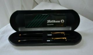 Two Pelikan K250 Black Ballpoint Pens With Gold Trim With Papers