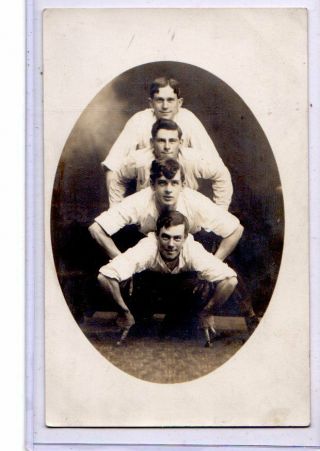 Studio Real Photo Postcard Rppc - Four Men Posed On Top Of Each Other