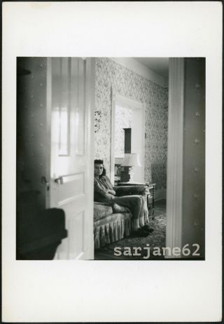 Voyeur View Of Solemn Woman Sitting Quietly On Couch Vintage Photo