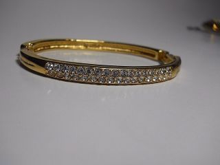 Swarovski® Signed Gold Tone Hinged Bracelet Double Row Pave Crystal Swan Logo