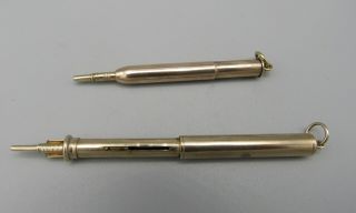 TWO ANTIQUE GOLD CASED PENCILS early 20th CENTURY 7