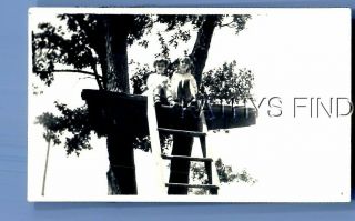 Found B&w Photo U_9789 Girls In Dresses Sitting Up Ladder In Small Tree House
