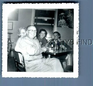 Found B&w Photo U_9215 Men And Women Sitting At Table With Beer Bottles