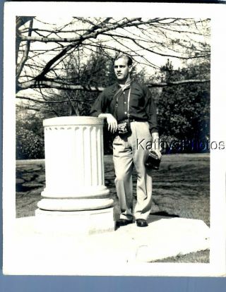 Black & White Photo M_5254 Man Posed With Camera Around Neck Holding Other Camer