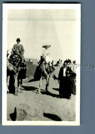 Found B&w Photo D_9210 Man In Suit And Woman In Dress Sitting On Camels