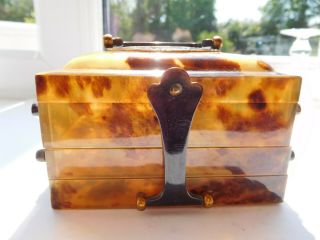 Faux Eastern tortoise shell trinket box with dragon on lid with handle 3 drawers 3