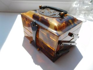 Faux Eastern tortoise shell trinket box with dragon on lid with handle 3 drawers 5