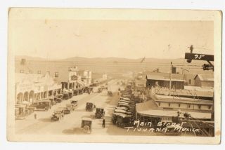 Rppc Photo Main Street Scene Tijuana Mexico Storefronts Signs Bars Cabaret 1920s
