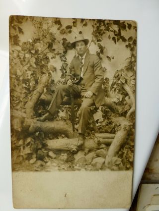 Rppc Man W Hat Sits On Tree Log Great Studio Prop Antique Real Photo Postcard