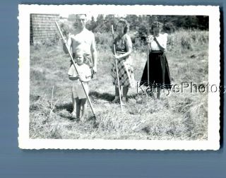 Found B&w Photo N_2683 Man Posed By Pretty Women In Dresses Holding Rakes