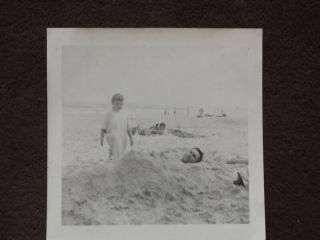 Father Buried In The Sand At The Beach By His Daughter Vtg Photo