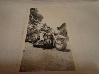 Man Sitting On Vintage Motorcycle Vintage Black & White Snapshot