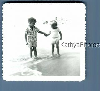 B&w Photo F,  2841 Boy And Girl Holding Hands On Beach