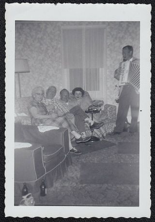 Old Vintage Antique Photograph Man Playing Accordion For People Sitting On Couch