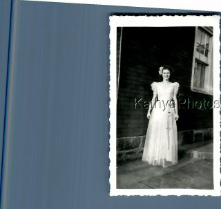 Found B&w Photo C,  5264 Pretty Woman In Dress Posed Smiling By House