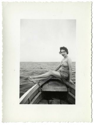 Boat Beauty Pinup Pose.  1940s Vintage Photo Of A Woman In A One - Piece Swimsuit