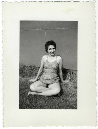 The Glamour Girl Sitting On The Ground.  1940s Vintage Photo Woman In A Swimsuit