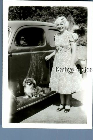 Found B&w Photo C,  4833 Pretty Woman In Dress On Side Of Car By Small Dog