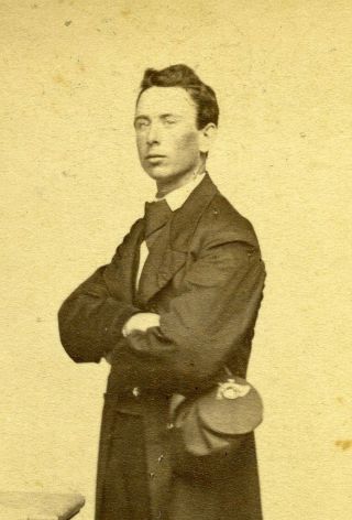 Portrait Of A Young Man Holding Civil War Forage Cap With Infantry Insignia