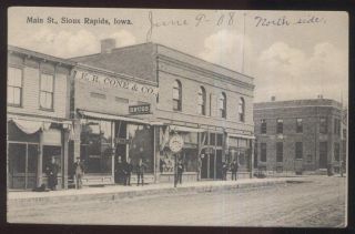 1908 Postcard Sioux Rapids Ia/iowa Cone Main St Drug Store & Giant Pocket Watch