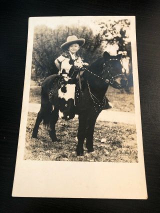Azo Rppc Photo Postcard - - Little Boy Dressed As Cowboy With Chaps Hat On Poney