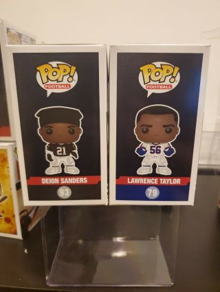 FUNKO POP DEION SANDERS 93 LAWRENCE TAYLOR 79.  TOYS R US EXCLUSIVE.  CHECK PICS 4