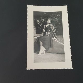 Vintage Photo Woman Sitting On A Wall With High Heels