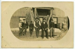 Rppc,  Group Of Men And Boys,  Factory Or Work Shop,  Poles,  All Are Smoking Cigars