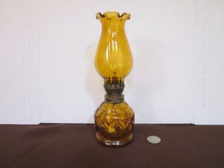 Decorative amber glass oil lamp diamond design on base hurricane top 8.  5 
