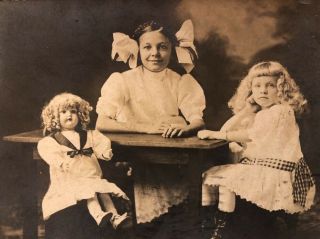Rppc Sweet Little Girls W/ Large Doll Seated Around Table Blonde Curls Postcard
