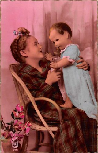 Girl Feeding Baby Doll Tinted Real Photo Antique Postcard J73931