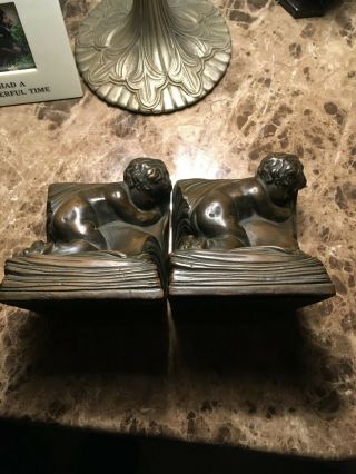 Armor Bronze Clad Cupid Bookends By A.  Johnson