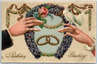 Vintage " Birthday Greeting " Postcard Hands / Wedding Rings Purple Flowers 1908
