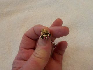 10 Kt.  Gold Mack Truck Award Pin With 2 Ruby Chips And One Diamond Chip