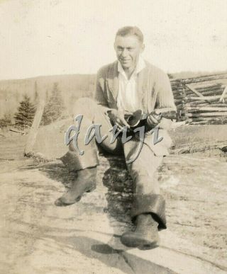 Young Man Sitting On A Rock Playing A Ukulele Old Music Photo