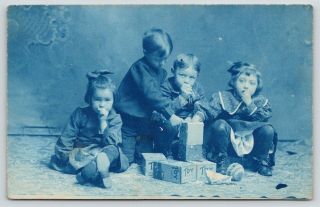 Rppc Cyanotype Foursome Opens Toy Cats Boxes Hold Hands To Mouths Knit Ball 1910