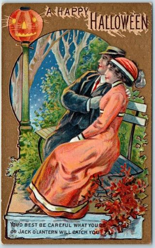 Vintage 1910s " A Happy Halloween " Postcard Couple On Park Bench 552