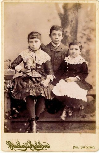 1880 - 89 3 Sf California Siblings,  Girl With Doll,  Boy Skirt Photograph