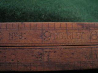 Vintage Stanley number 61 24 inch folding rule brass and wood with its pins. 2