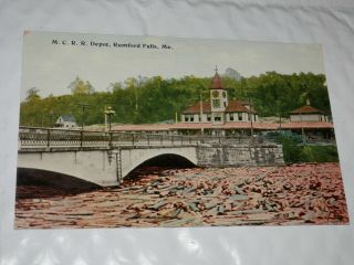 Rumford Falls Me - 1912 Postcard - M.  C.  R.  R.  Depot Railroad Station - River Logs