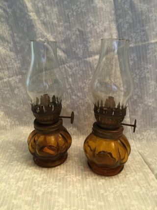 Set Of Miniature Oil Lamps.  Amber Glass.  Clear Chimney.  One Has A Wick,