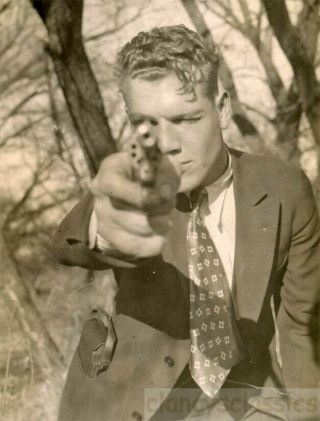 1928 Man Shoots Gun Points Pistol At Camera